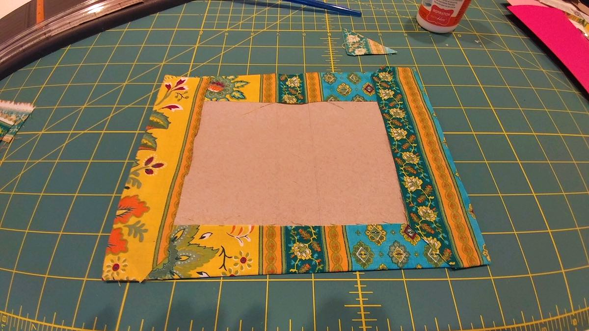 Applying the fabric to the cover base