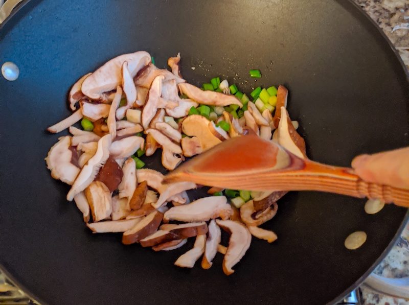 Sautéing the sliced mushrooms and green onion for the Air Fryer Egg Rolls filling