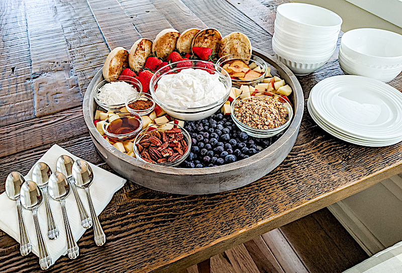 Marie's Easy Easter Brunch on a table with plates and serving spoons