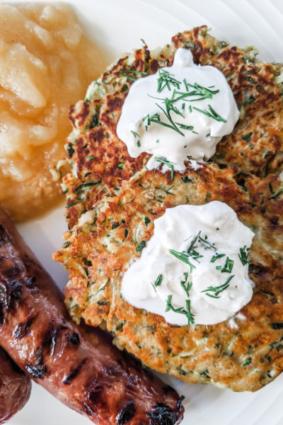 zucchini cakes served with sausage and apple sauce