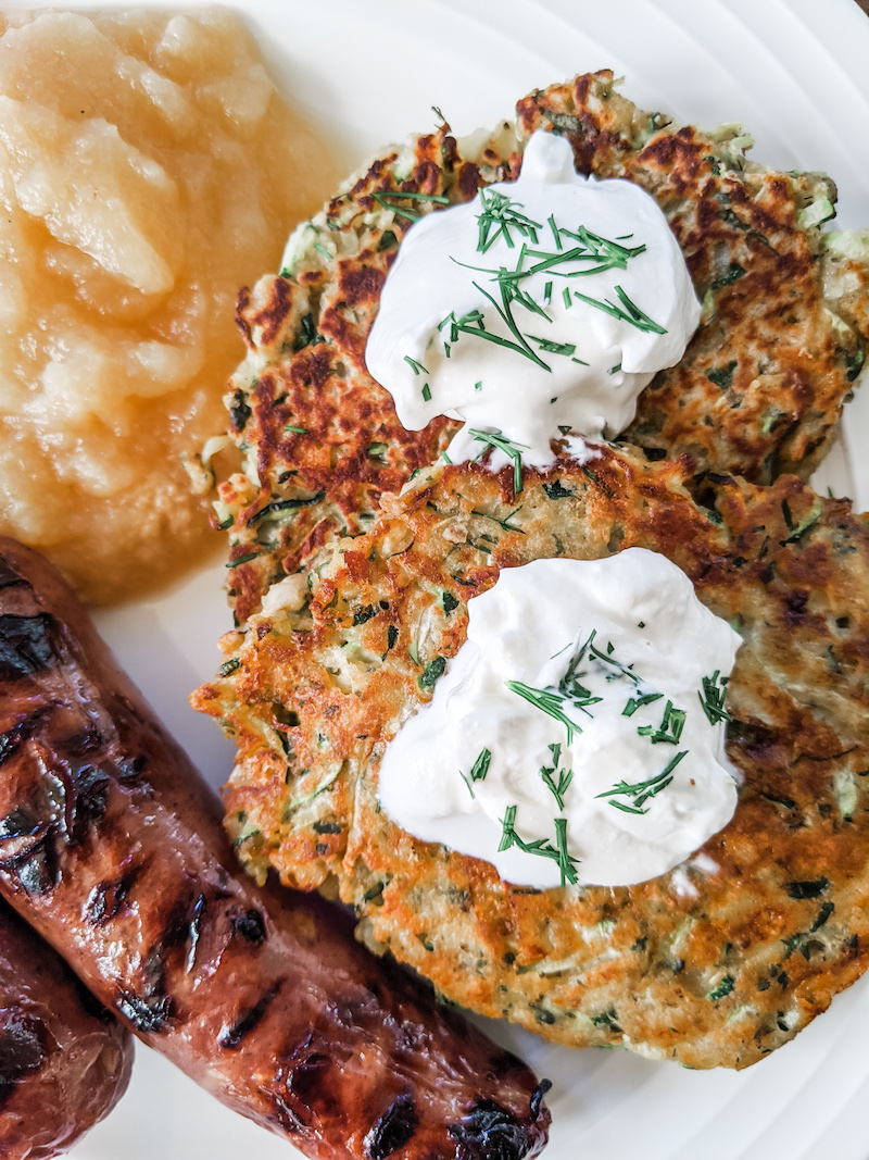 zucchini cakes served with sausage and apple sauce