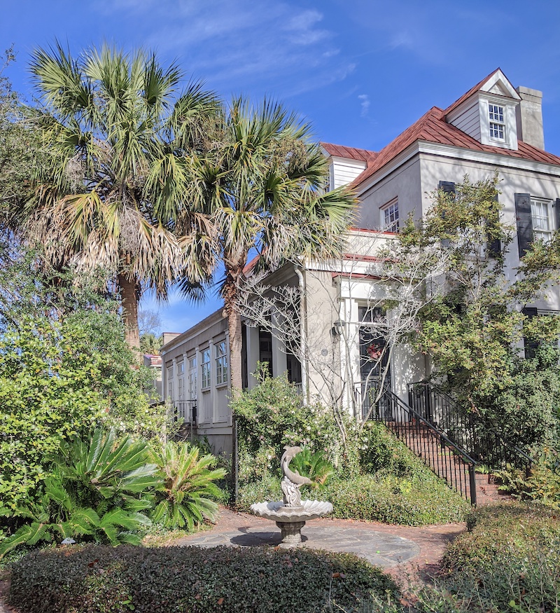 The Restoration of Celia Fairchild Inspiration found in the form of a Charleston older home with a garden and statue