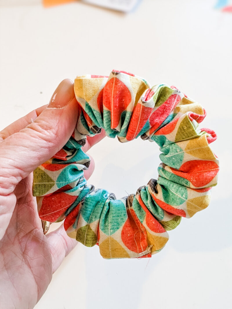 a multi-colored easy diy scrunchies being held
