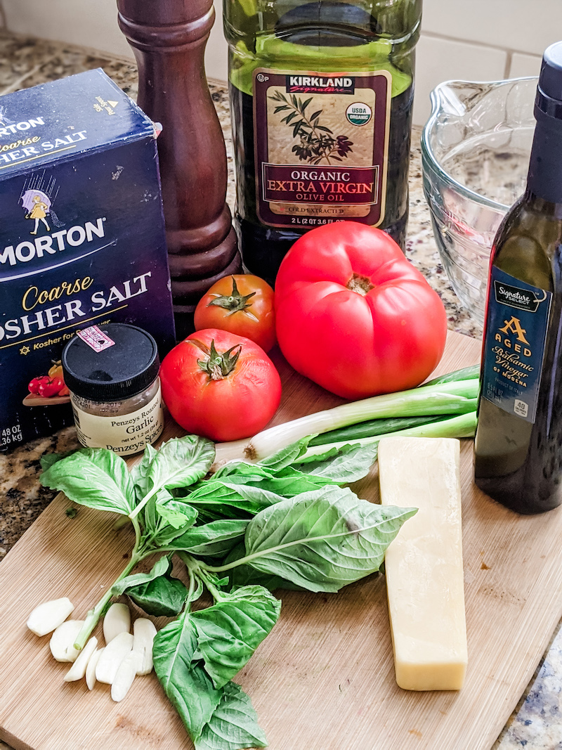 The ingredients for the tomato bruschetta laid out on a table