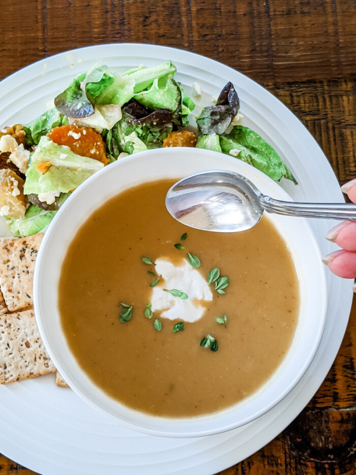 Crocktober Recipe Round-up - the zucchini soup in a bowl with a dollop of sour cream