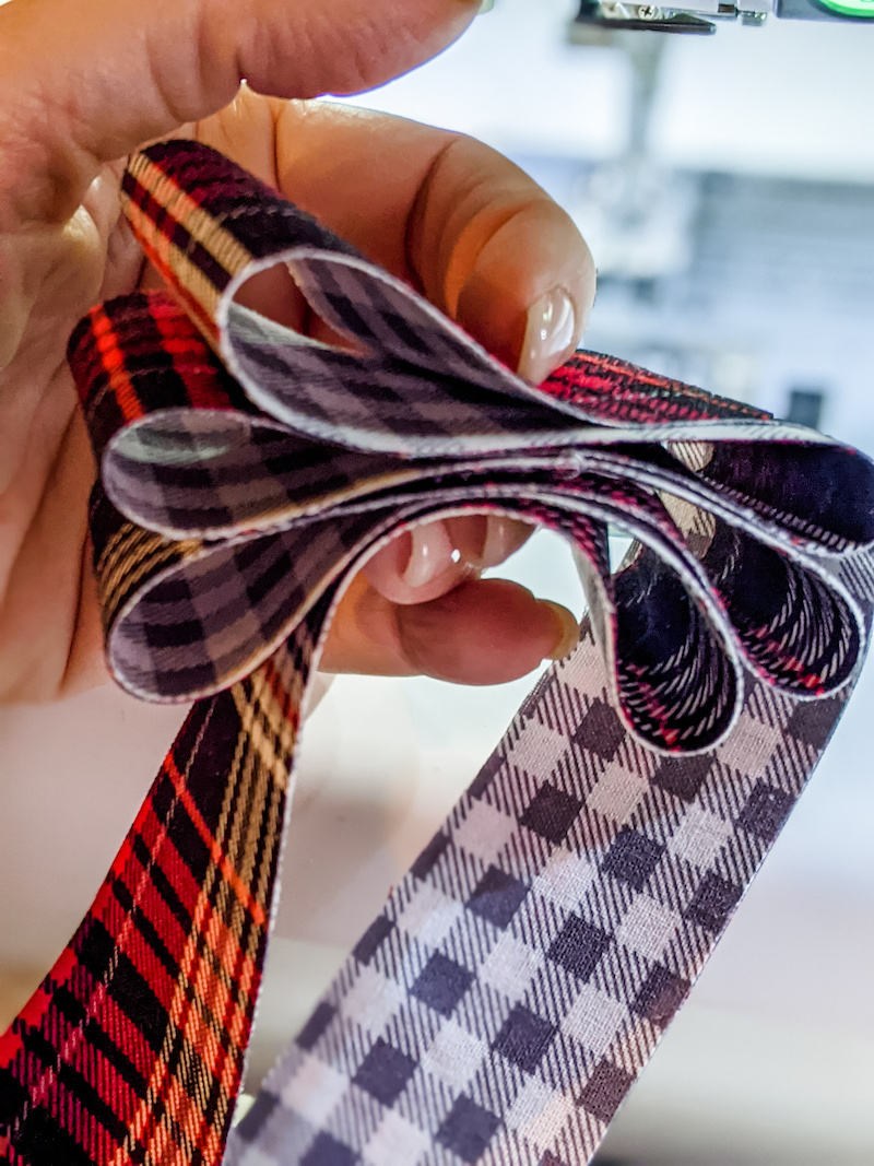 Creating the 'candy' ribbons by looping the fabric.