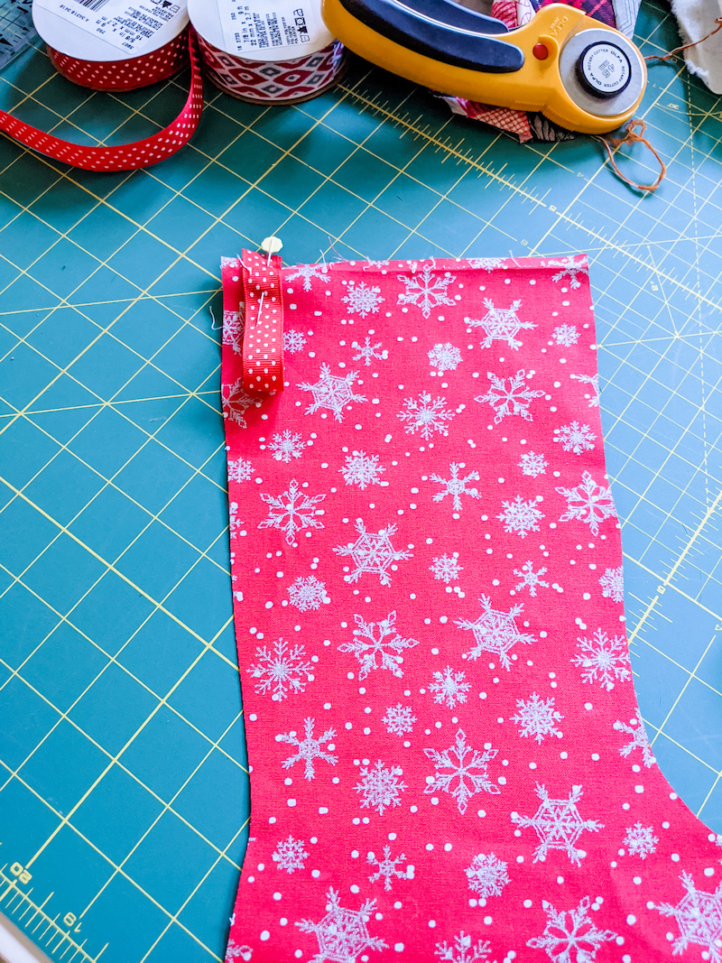 The pinned loop on the front of the Easy DIY Patchwork Christmas Stocking