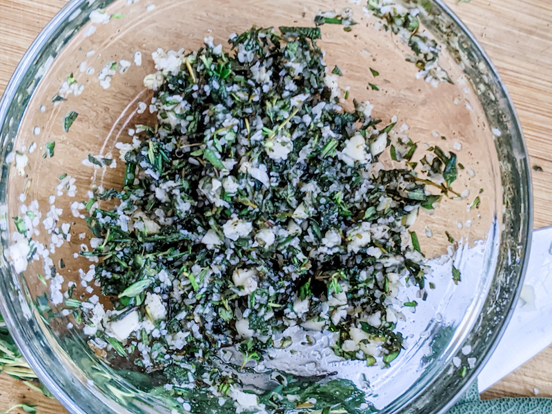 The herb mixture in a clear glass bowl