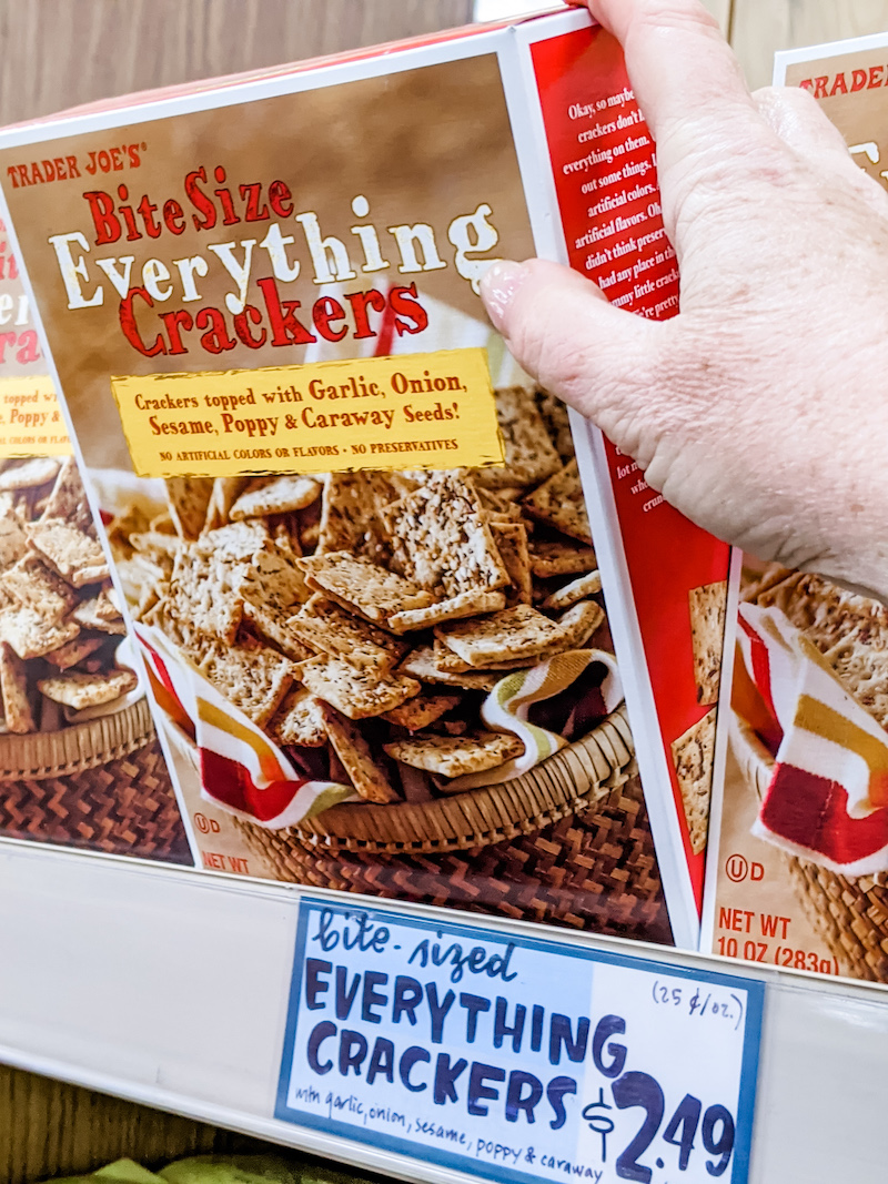 Marie pulling a box of Everything Crackers off a shelf