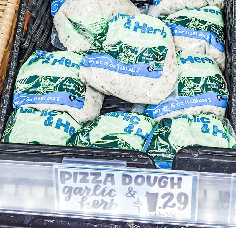 Packages of the pizza dough in their refrigerator basket