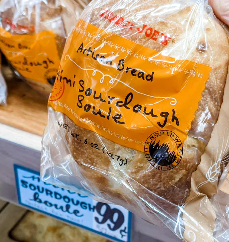 A hand holding a Mini Sourdough Boule, one of Marie's Trader Joe's Winter Favorites 