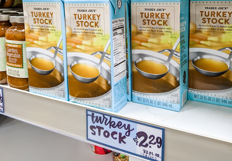 Several boxes of turkey stock on a shelf.