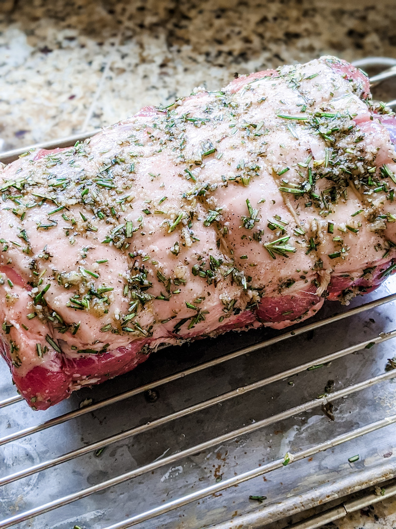 The cut of boston pork butt marinating and ready to be placed into the oven