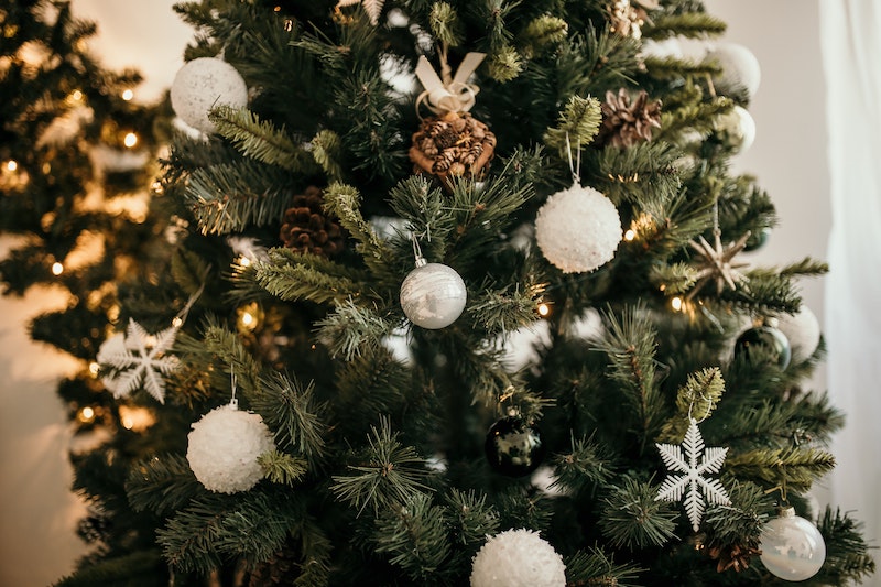 A Christmas Tree, fully decorated with bulbs and lights.