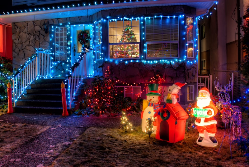 A house with outdoor Christmas decor and lights - a great tradition for Celebrate Christmas from Home