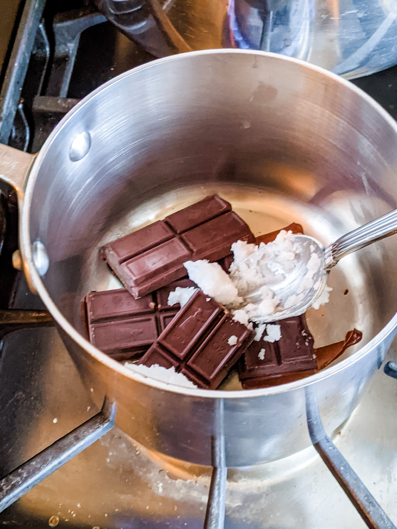 Peppermint and chocolate being mixed in a double-boiler