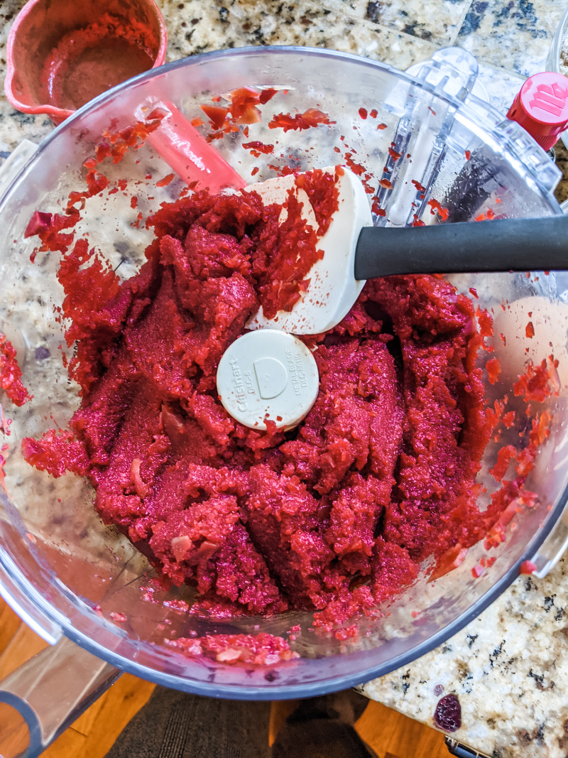 The beet puree being added to the cake mixture