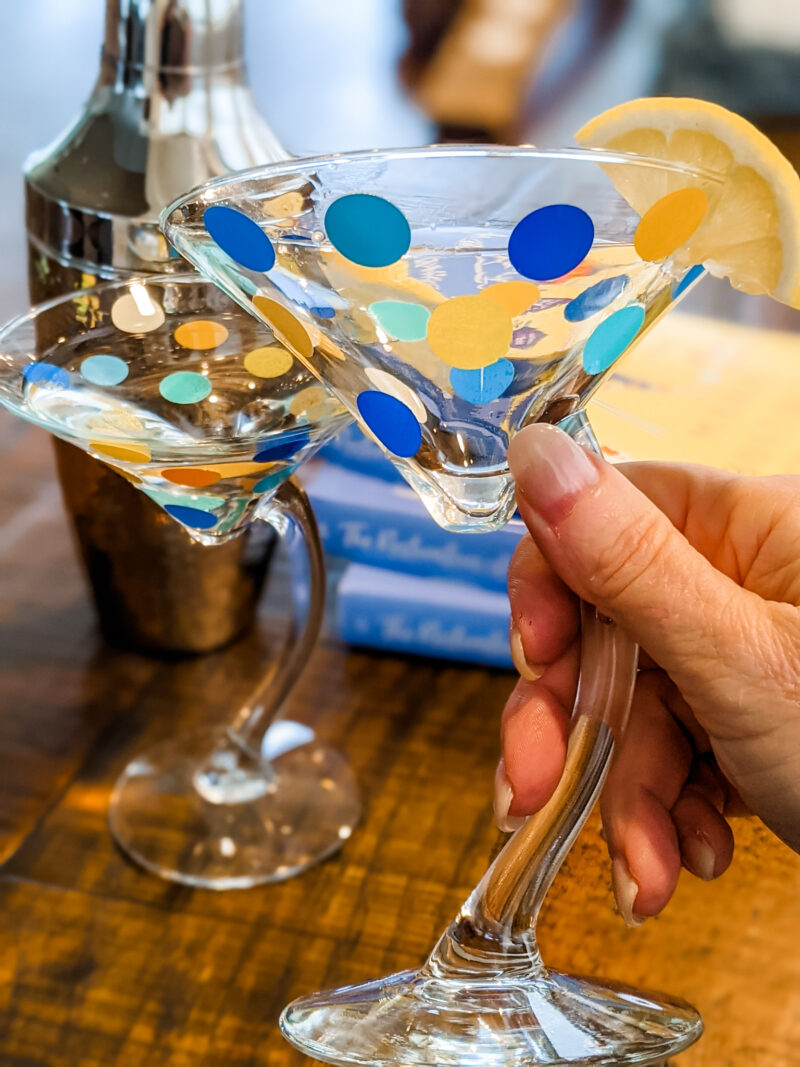 Two of the DIY Polka Dot Martini Glasses in front of a cocktail shaker