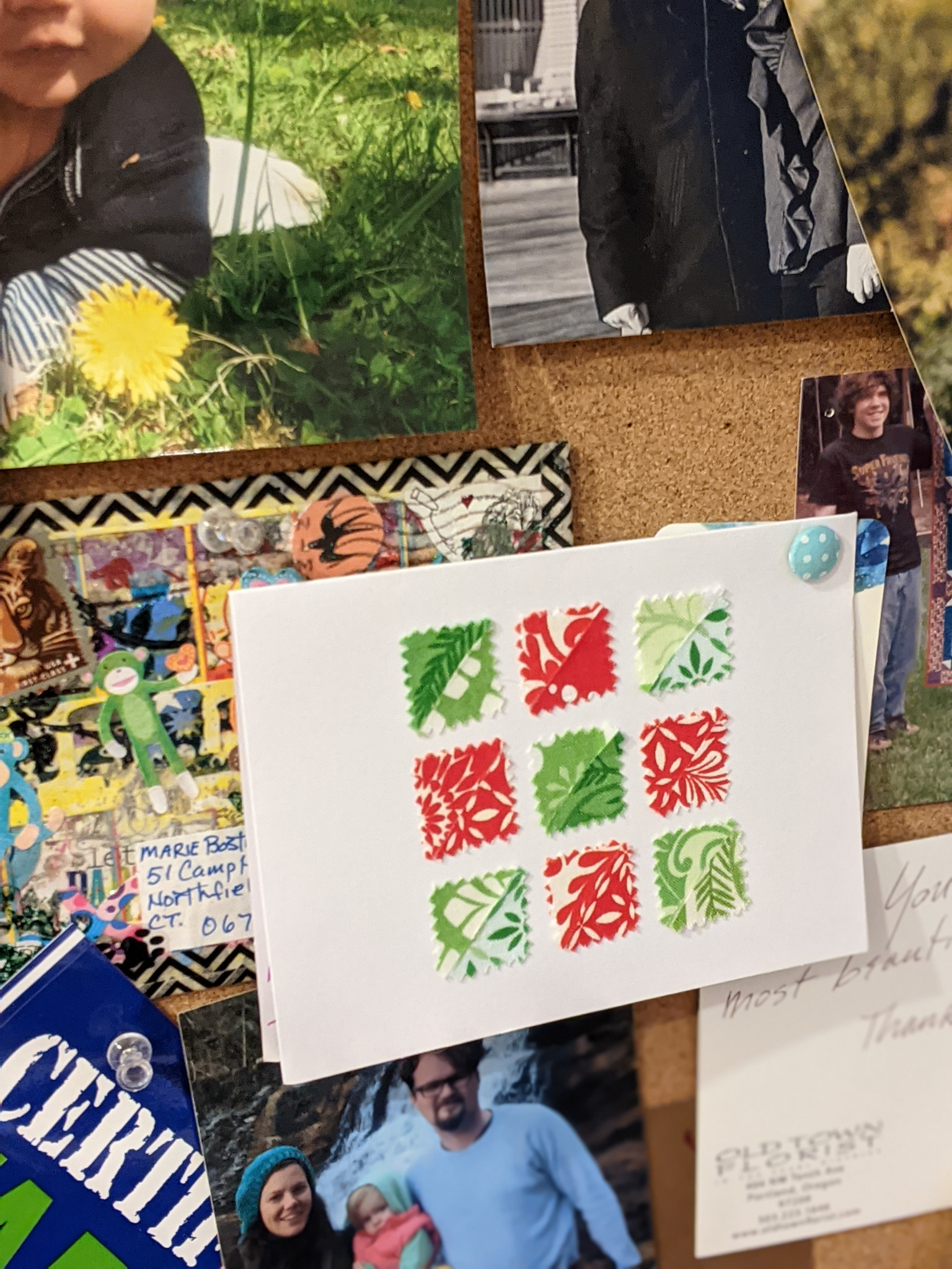 The Fabric Christmas card sent Marie pinned on a bulletin board
