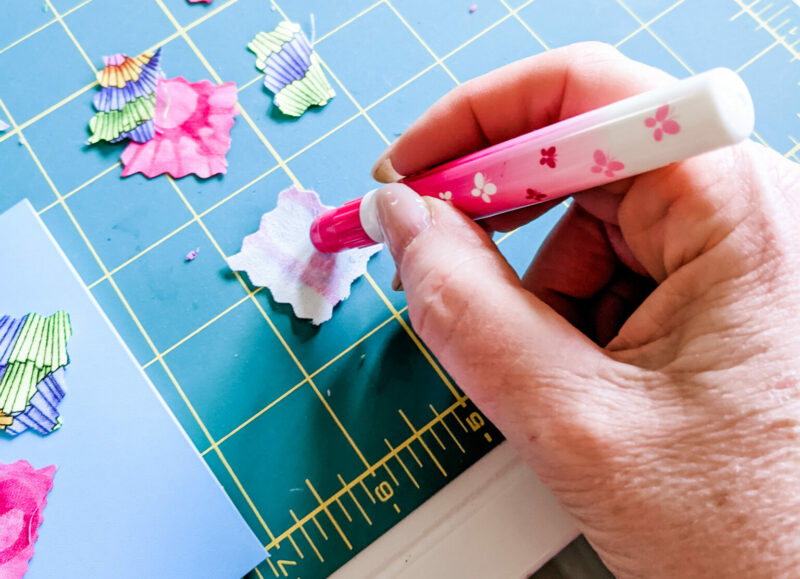 Marie gluing down a piece of fabric for the Fabric DIY Valentines