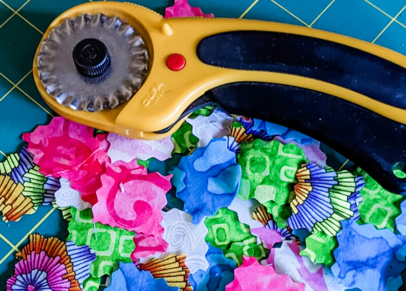 The scrap squares cut out next to the rotary cutter