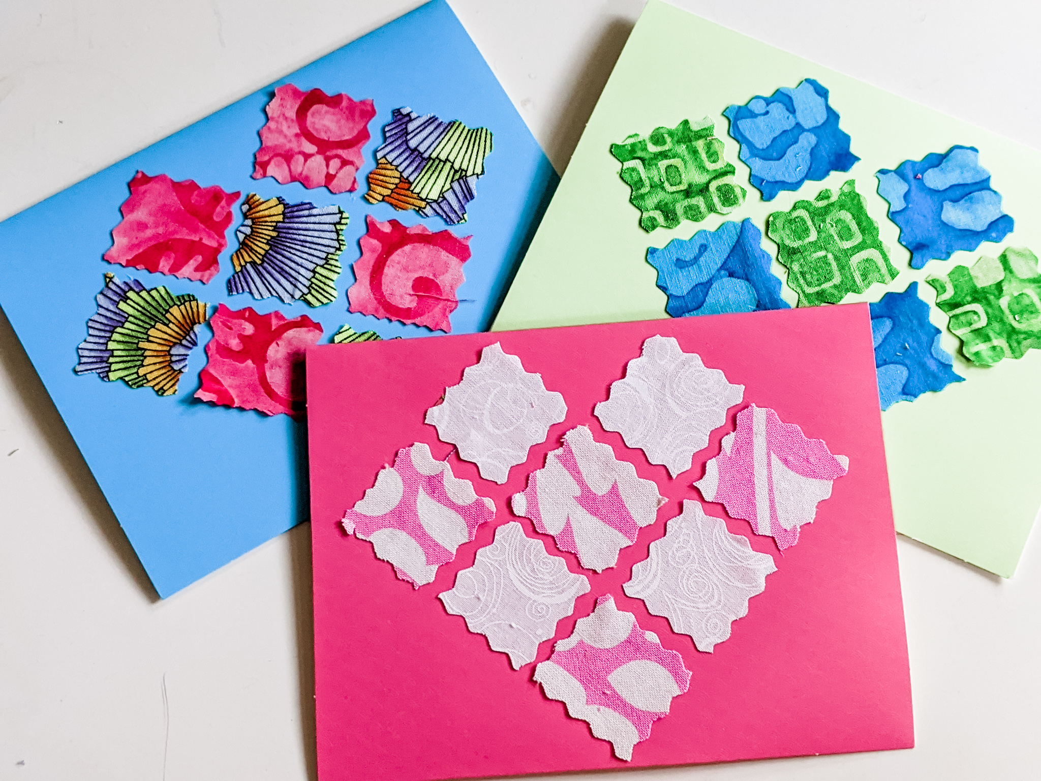Some of the finished Fabric DIY Valentines - a blue, pink, and white one.