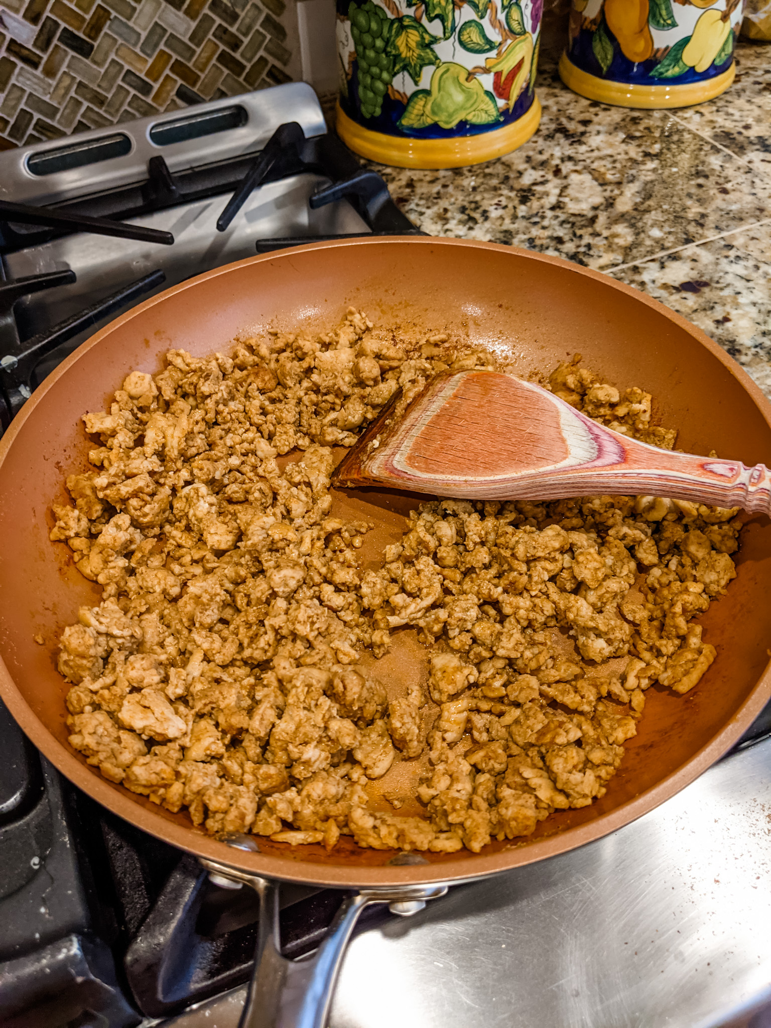 Chicken with taco mix, browning in a pan.