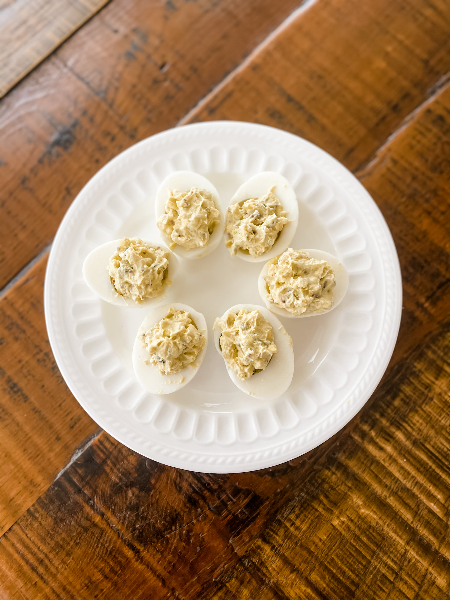 The basic version of the lighter deviled eggs on a white plate.