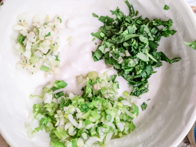 Chopped herbs in the dressing mixture.