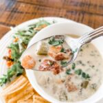 A bowl of the Quick and Creamy Seafood Chowder with a spoon