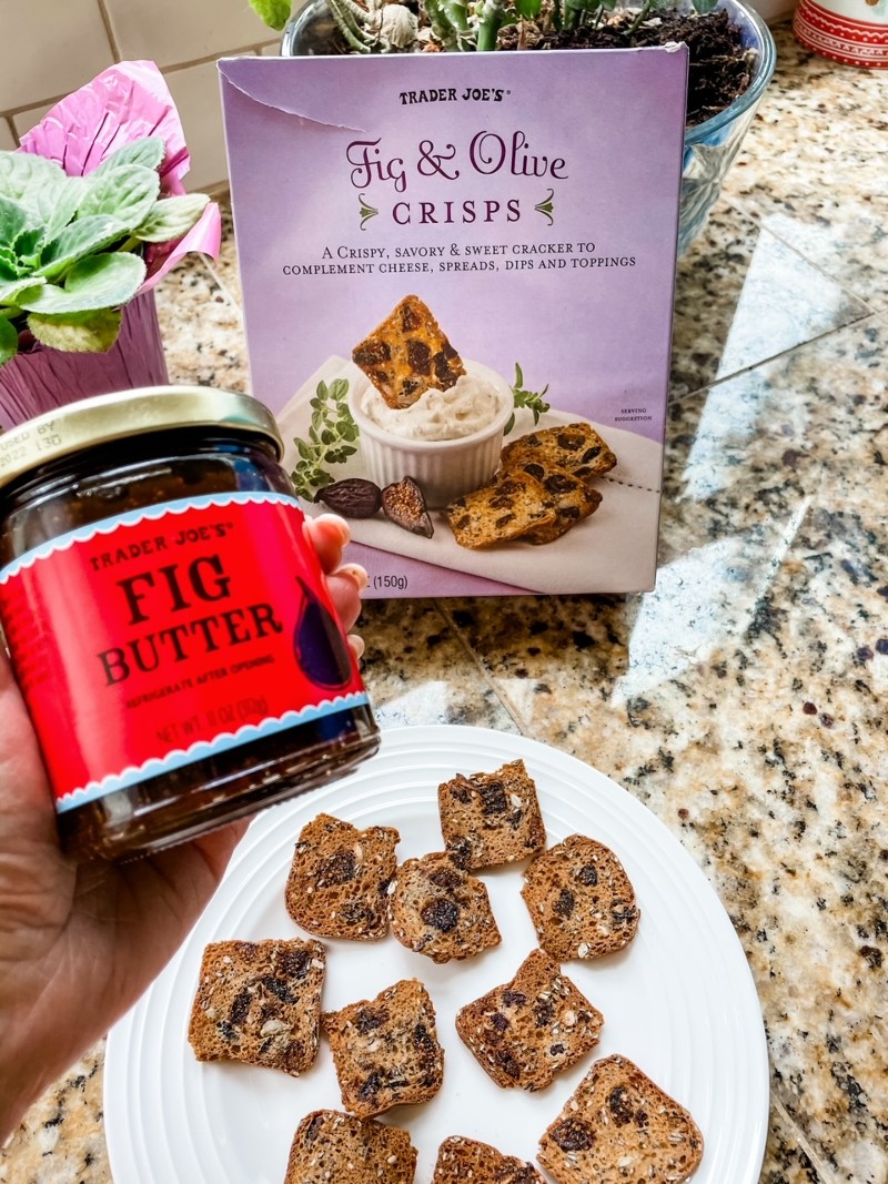 The Trader Joe's Fig Butter and the crispy crackers on a plate.