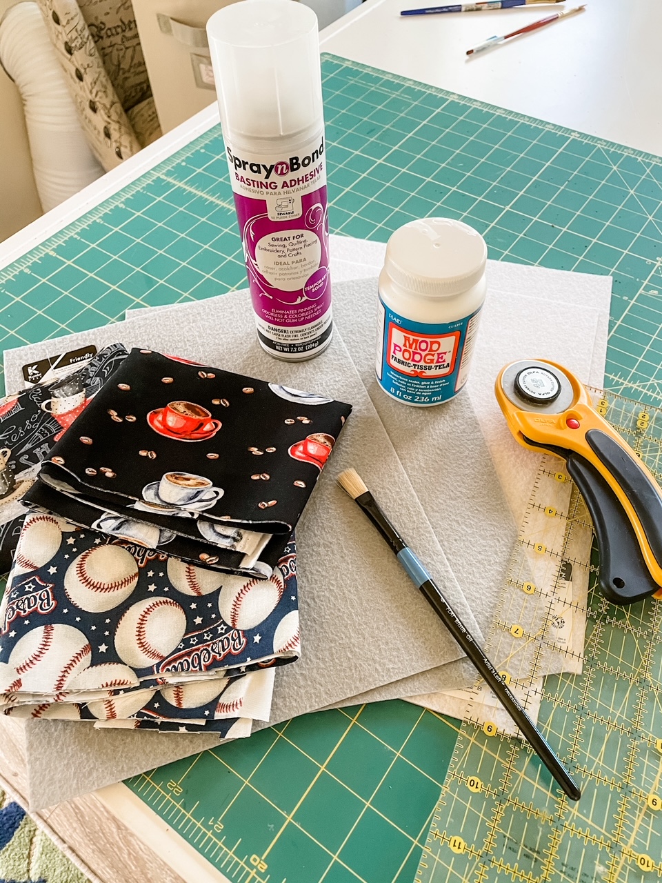 The materials for making the coasters nestled on top of a measuring pad