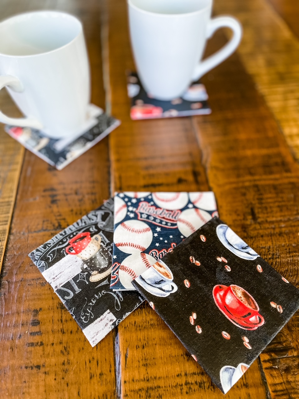 The easy no swe craft coasters - one with coffee, one with baseballs, and one with an abstract print