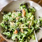 The Grapefruit and Gorgonzola Salad with Shrimp in a bowl, mixed with a fork