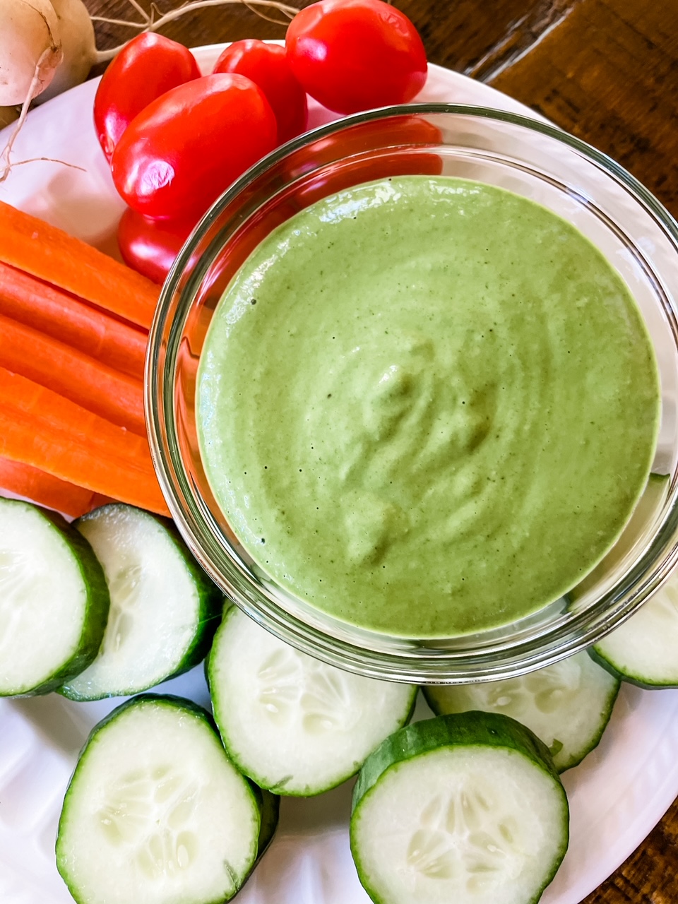 The Noticed this dressing making a comeback on grocery shelves? Well, you can make it even fresher with my Homemade Green Goddess Dressing!, with veggies to dip in - carrots, cucmbers, and tomatoes