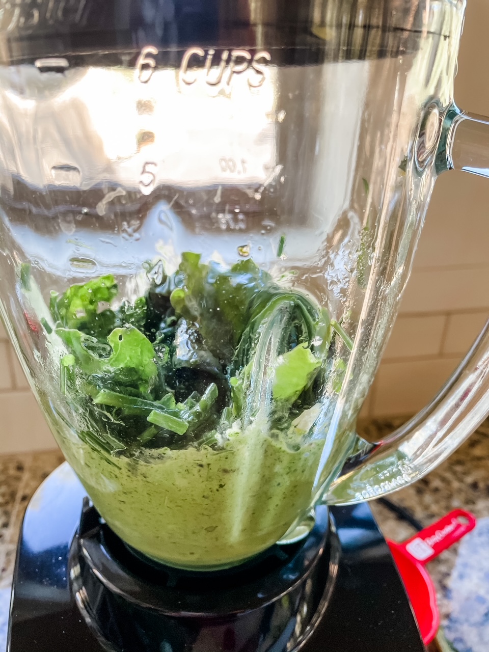 The greens prepped to mixed in a blender
