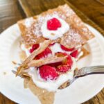 A fork taking a piece from the Raspberry Napoleons – A Healthy Dessert