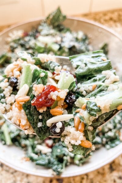A forkful of the Superfood Salad Recipe held over a bowl