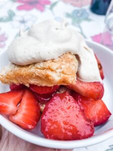 The Homemade Shortcake Biscuits topped with strawberries and whipped cream