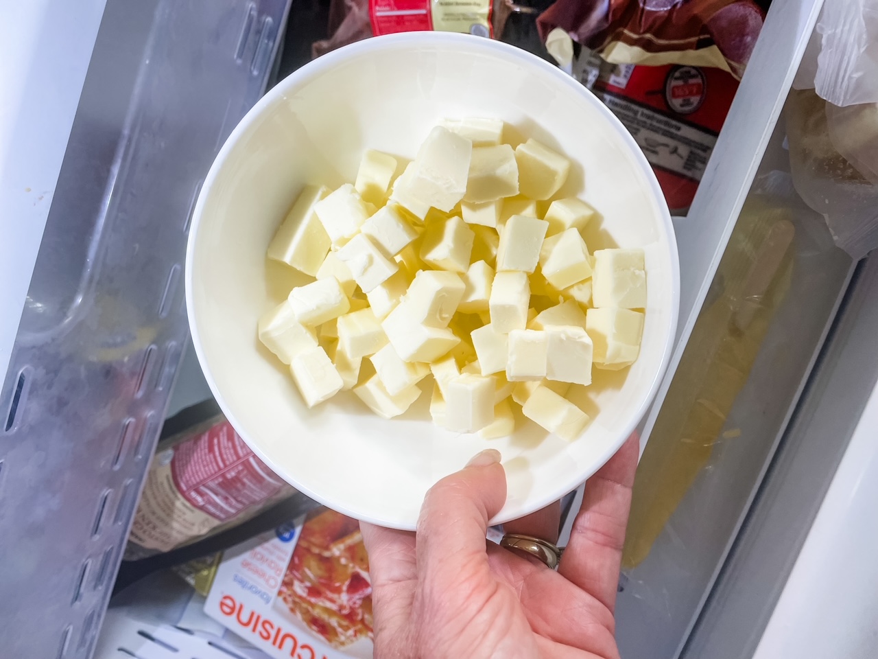 The cubed butter for the Homemade Shortcake Biscuits being placed in the fridge