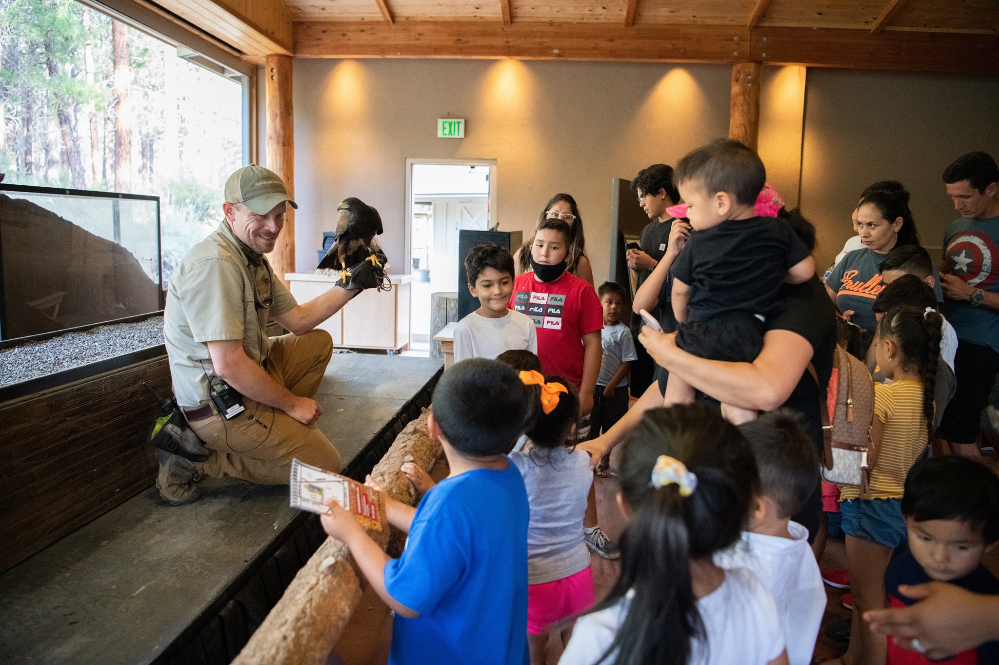 An image of a presentation at The High Desert Museum, attended by both kids and adults - one of the things to do in Bend, Oregon