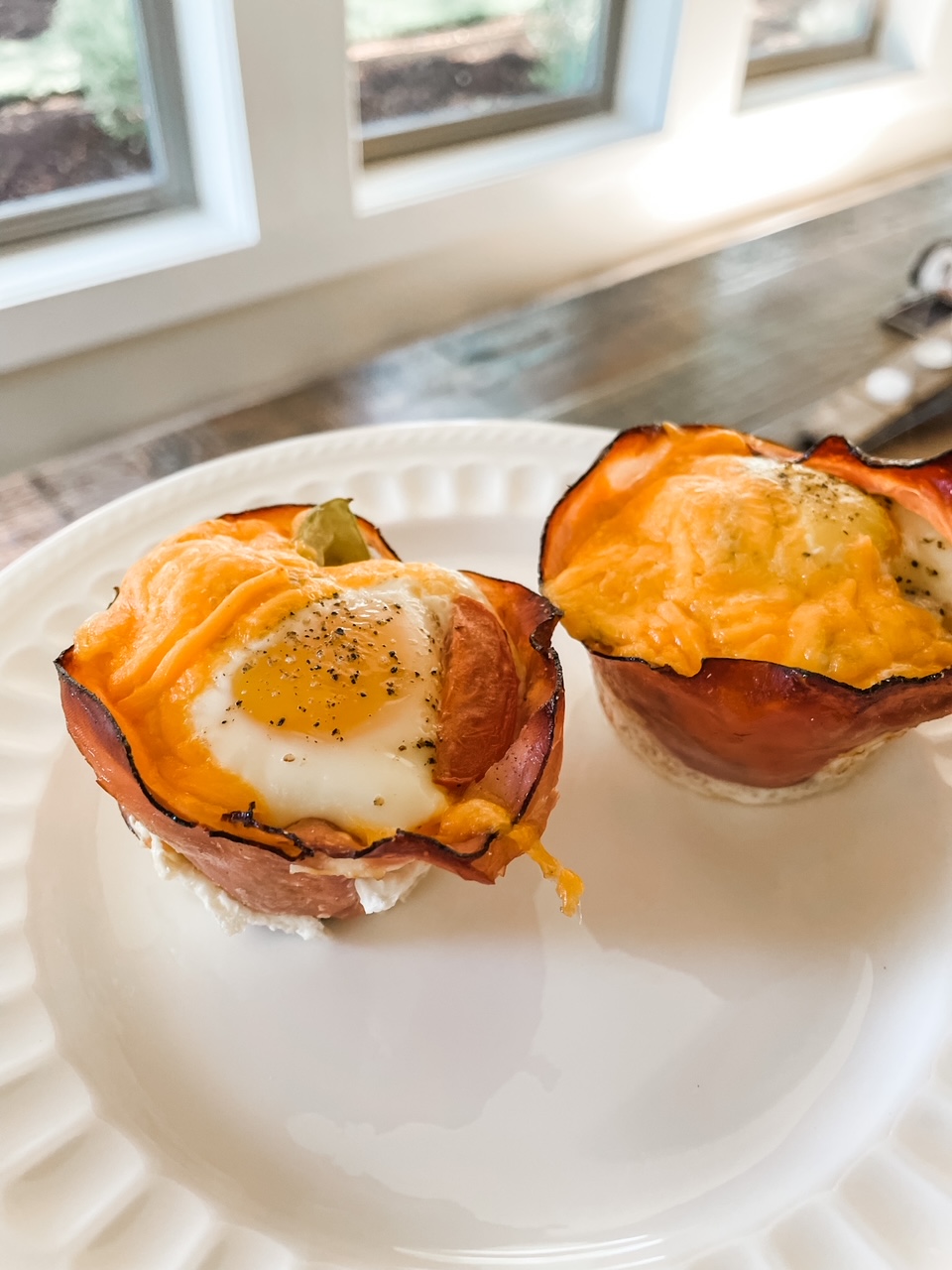 Two of the Easy Bacon and Egg Cups on a plate