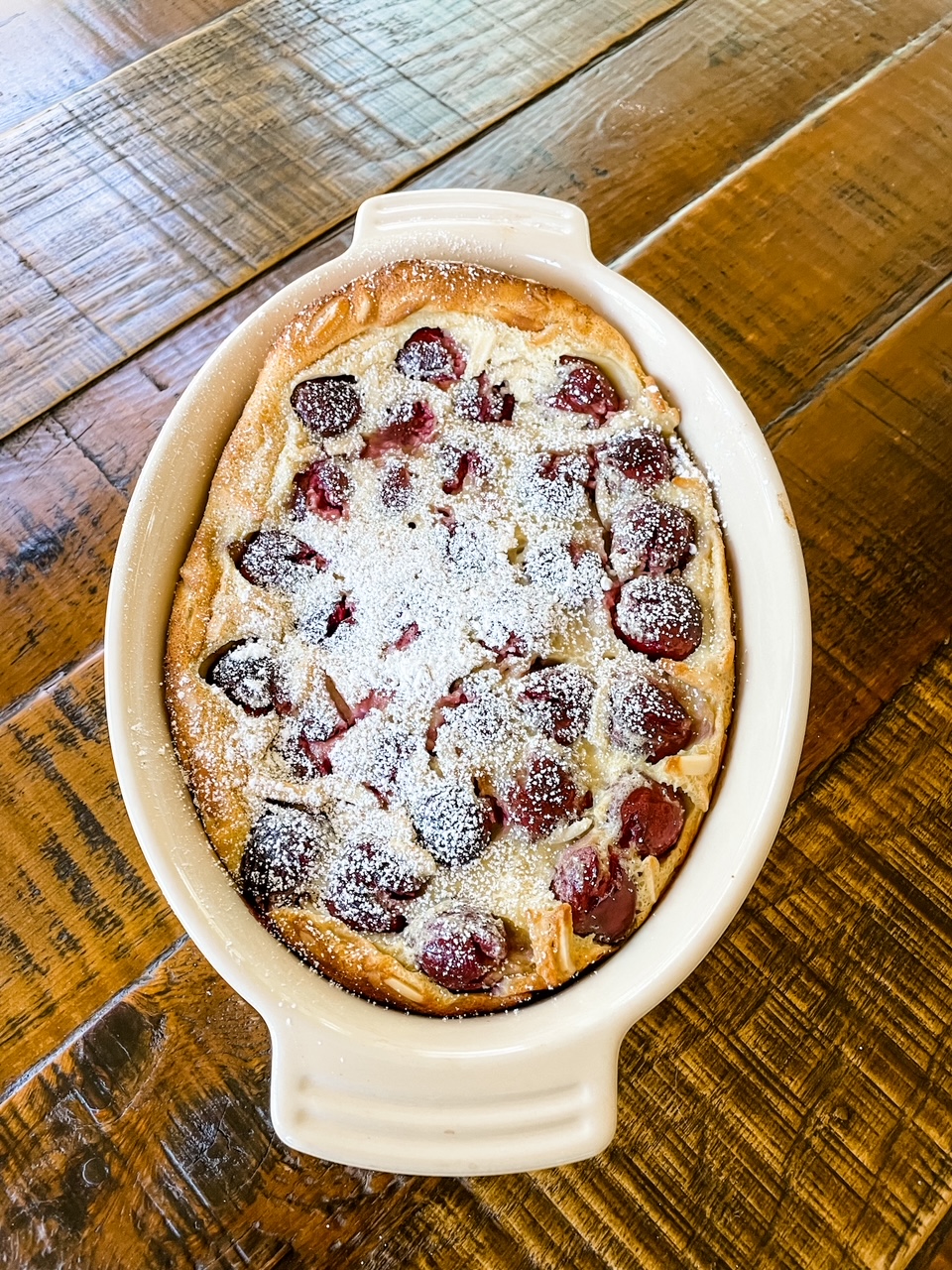 The finished Fresh Cherry Clafoutis in baking pan