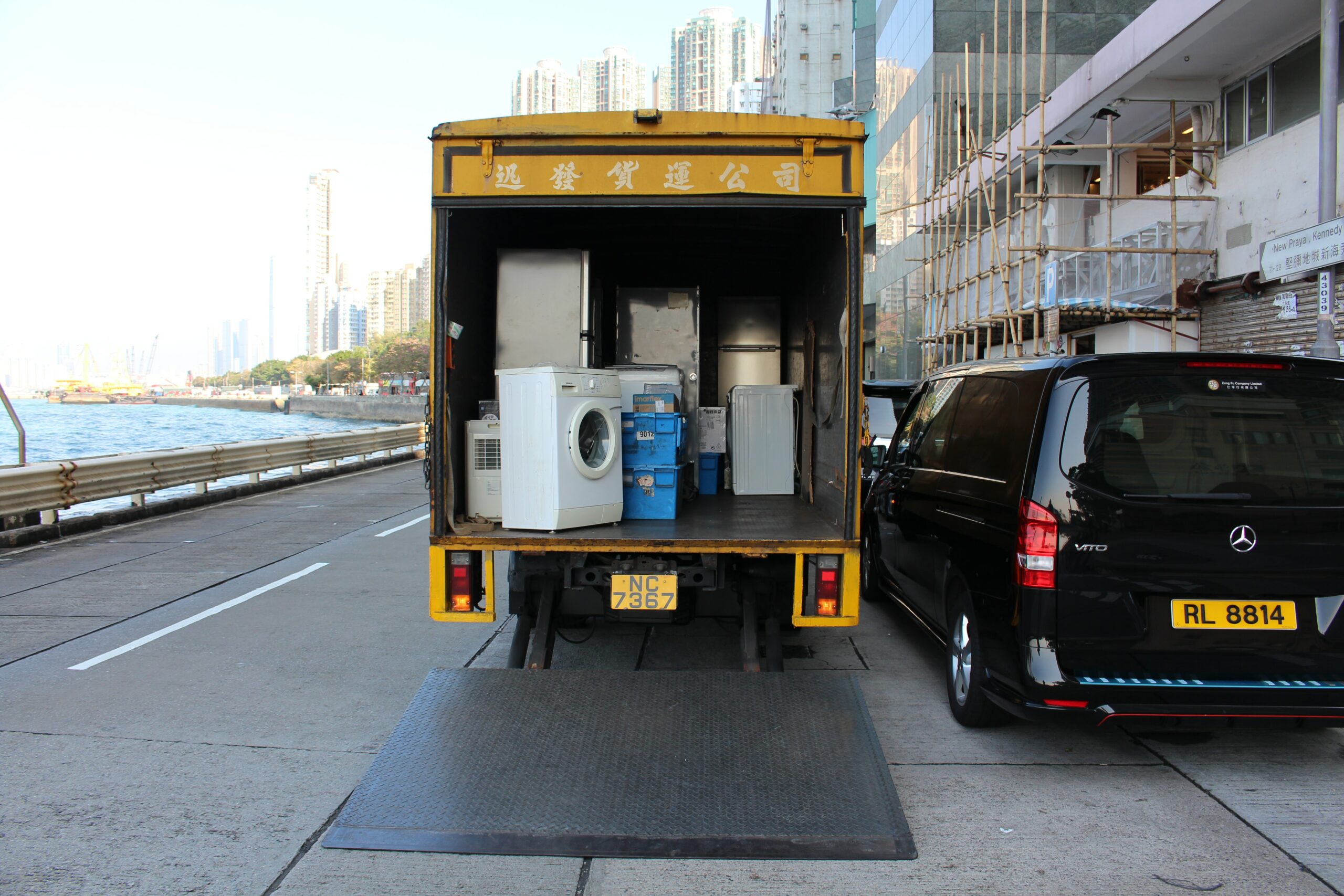 A full-service moving truck with items - including a washing machine - in it. One of the ways of moving out of state