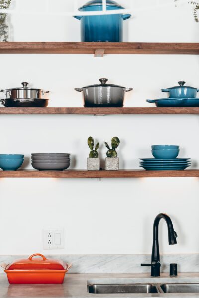 A wall full of kitchen tools and dishware