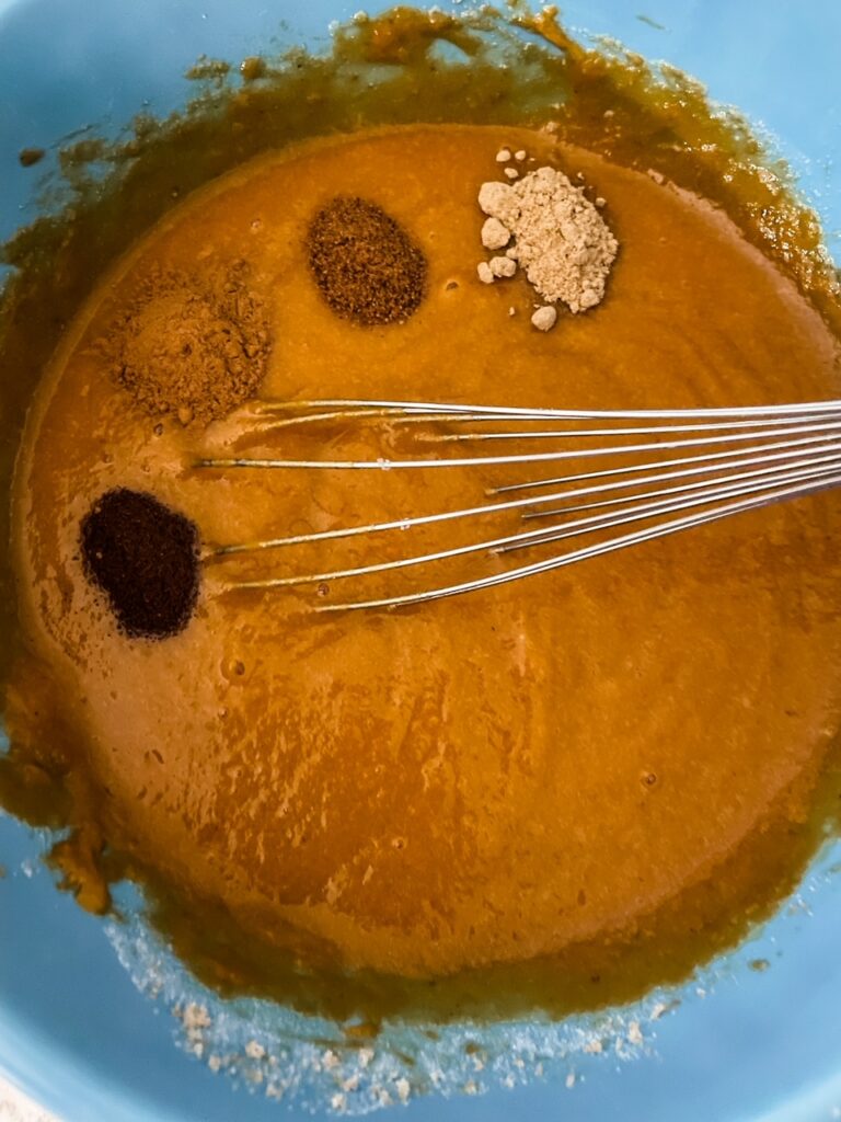 A mixing bowl with the pudding mixture inside