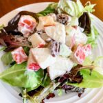 The finished Low Fat Waldorf Salad Recipe on a bed of lettuce