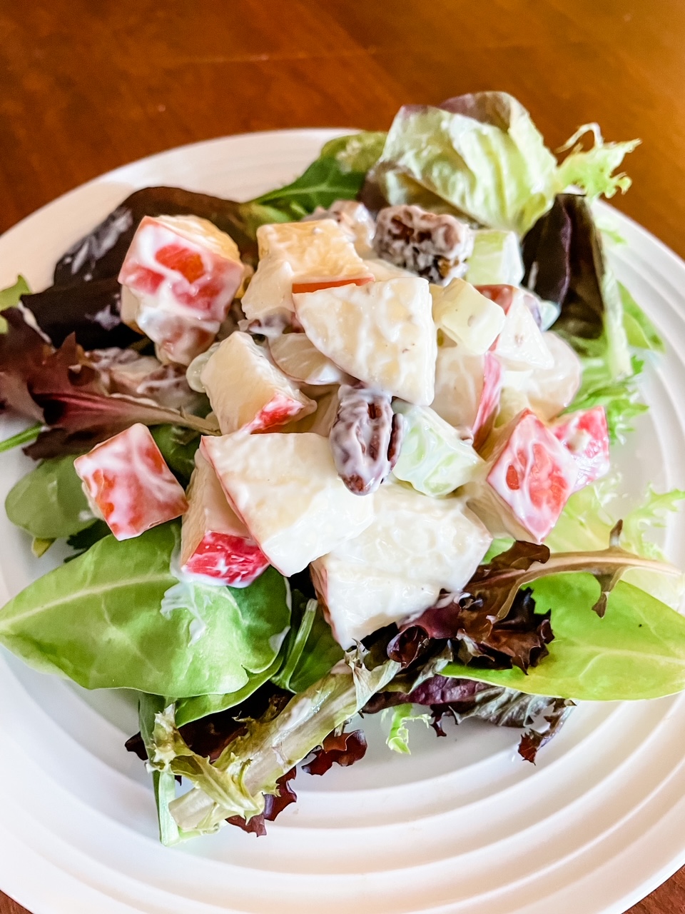 The finished Low Fat Waldorf Salad Recipe on a bed of lettuce