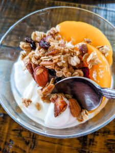 The homemade granola with yogurt and fruit