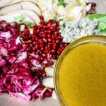 The Pomegranate and Pear Salad with Citrus Dressing in a bowl